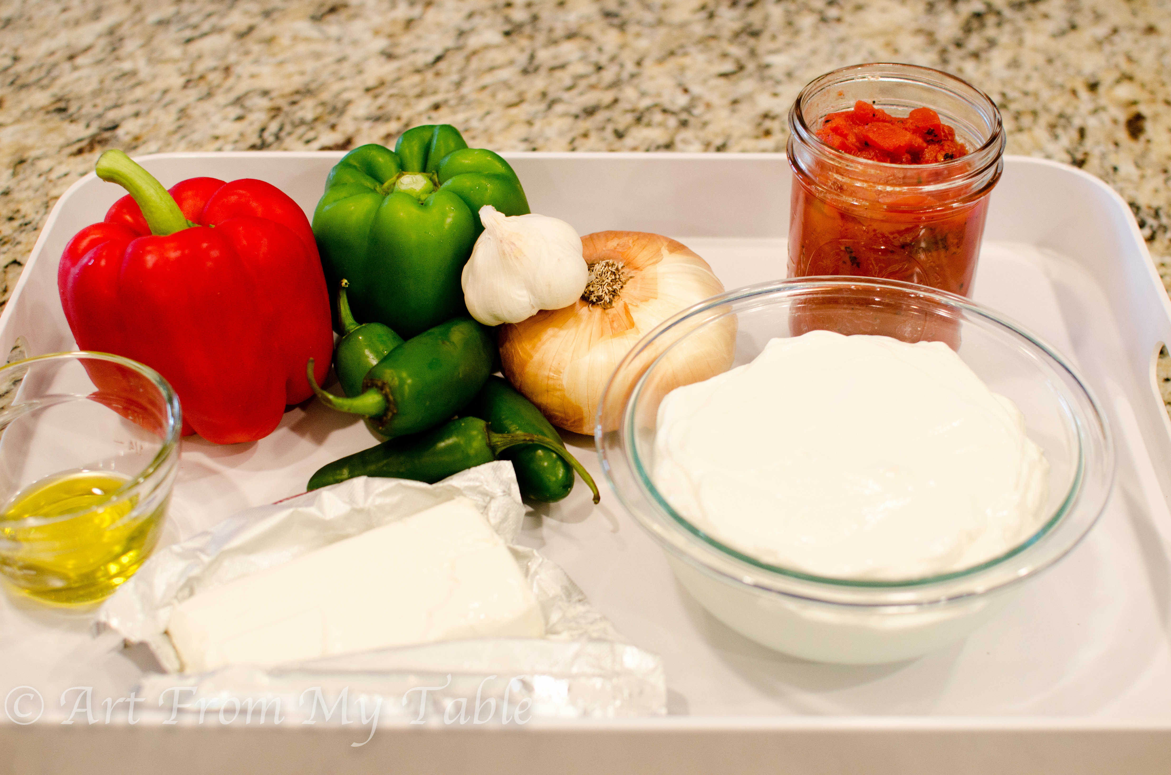 Ingredients for jalapeno yogurt dip: yogurt, vegetables, cream cheese, oil and tomatoes. 