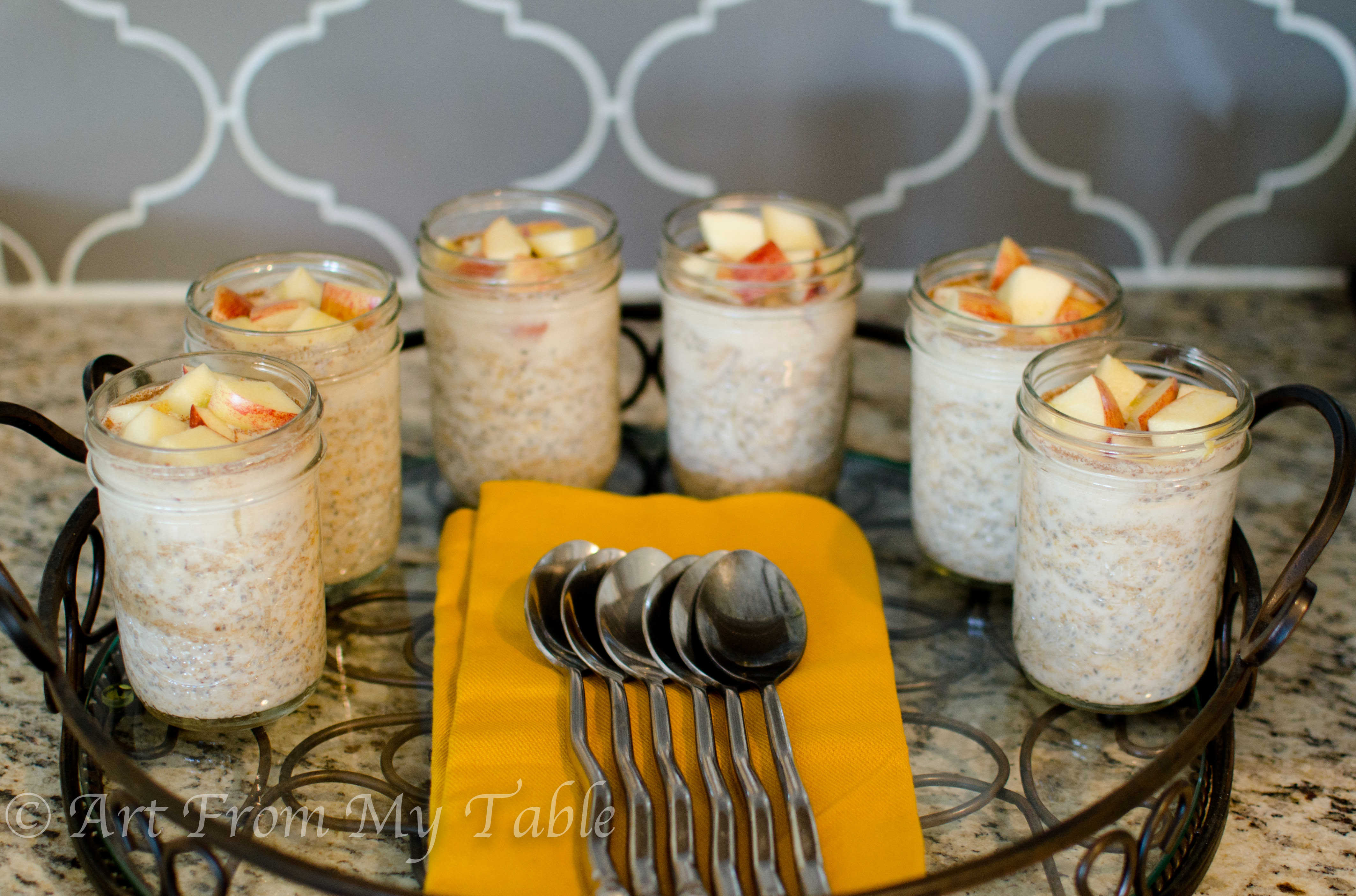 Tray of mason jars filled with Overnight oats. 