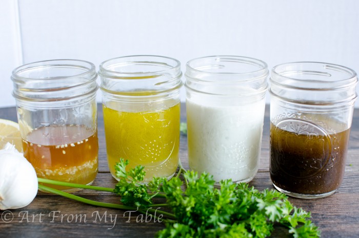 4 Mason jars, each with a different type of salad dressing in them made in 2 minutes.