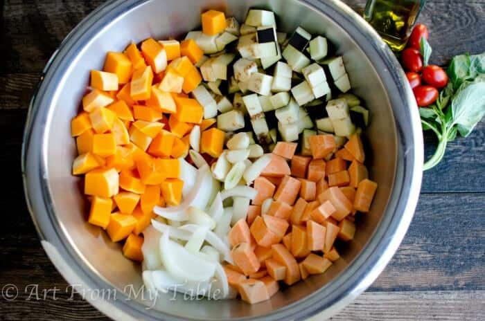 bowl of diced veggies: squash, onions, eggplant and sweet potatoes, for pizza.