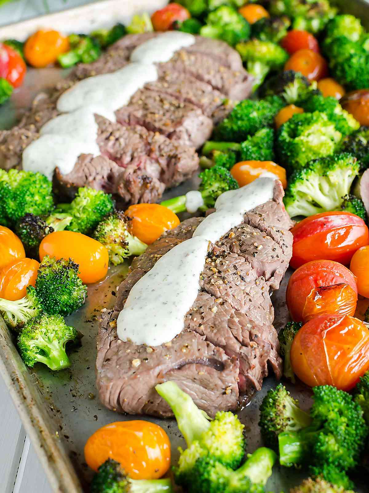 Sheet Pan Steak and Veggies  drizzled with Boursin Cheese Sauce, all on one pan. 