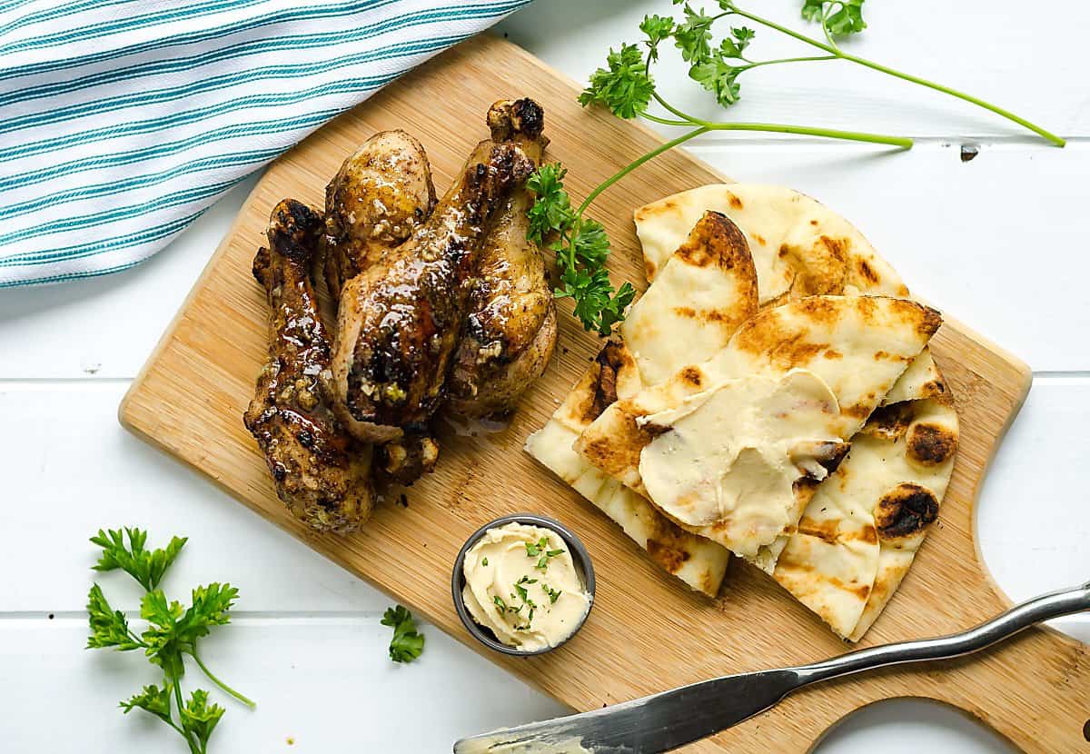 Indian Spiced grilled chicken with Naan and hummus