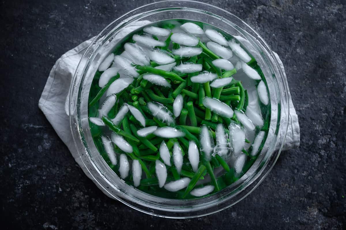 green beans in an ice bath