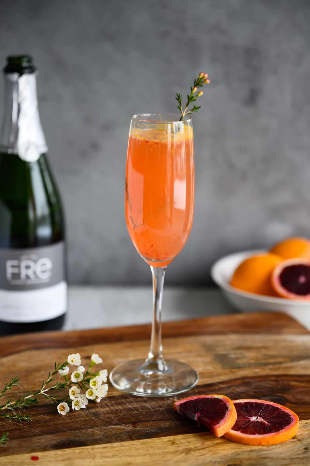 blood orange mimosa mocktail in champagne flute