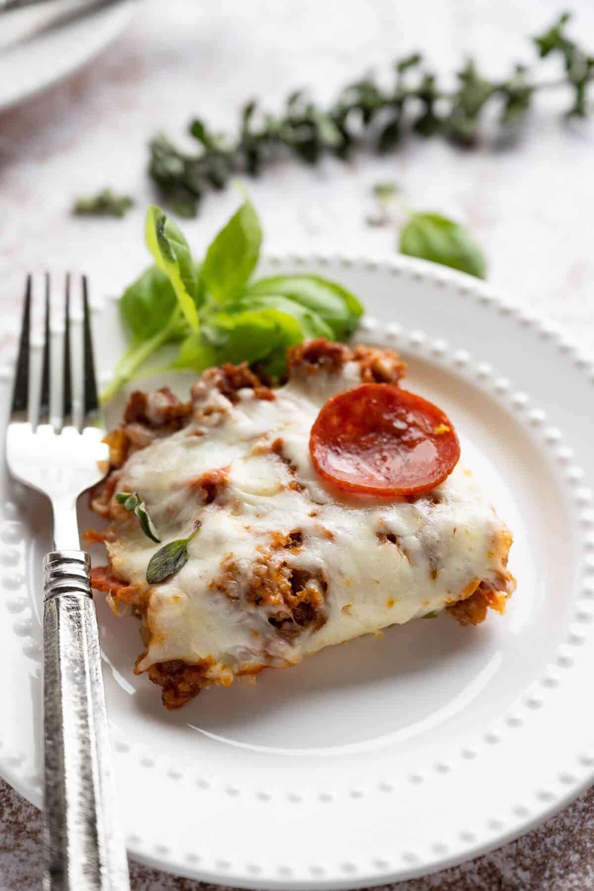 slice of pizza casserole on a white plate
