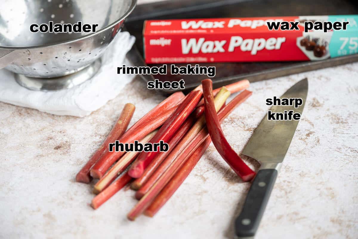 Ingredients and supplies needed to freeze rhubarb: rhubarb, sharp knife, wax paper, rimmed baking sheet.