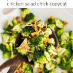 Wooden spoon full of Broccoli Salad being held over the platter of broccoli salad. Platter is slightly blurred. Text reads: "Broccoli Salad Chicken salad chick copycat".